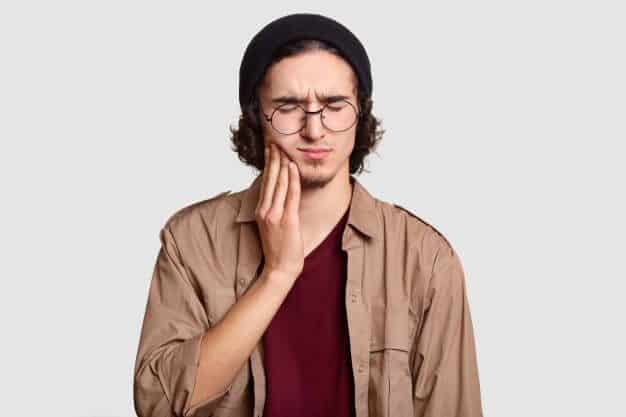 Young Man Experiencing Tooth Pain